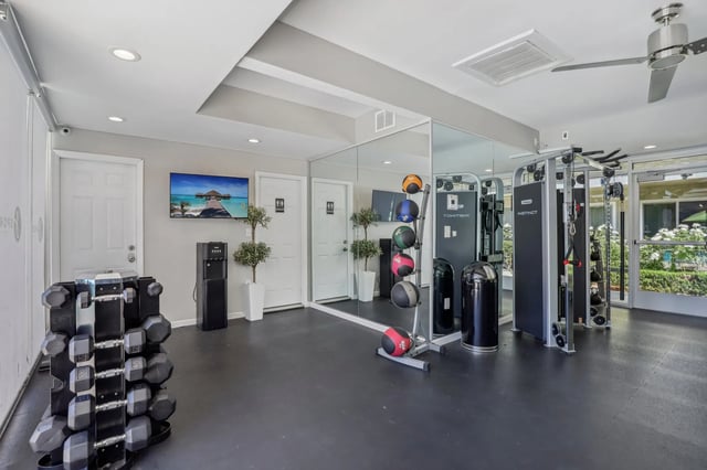 Dumbbell rack medicine balls gym equipment fitness room at The Spoke in Davis Student Accommodation
