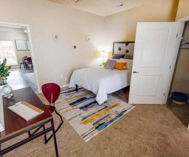 Bed desk chair rug and doorway bedroom at University Edge South Bend in South Bend Student Accommodation