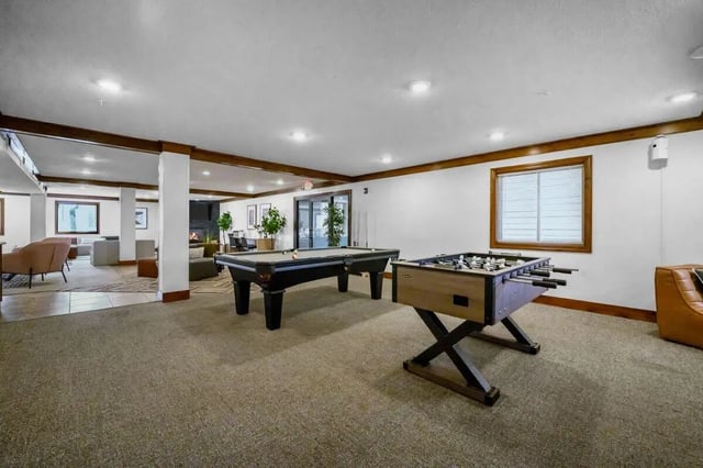 Pool table foosball table lounge area game room at The Grove at Mankato in Mankato Student Accommodation