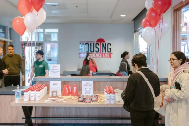Balloons people counter and giveaway items welcome area at The Douglas - Student Housing Apartments in Seattle Student Accommodation