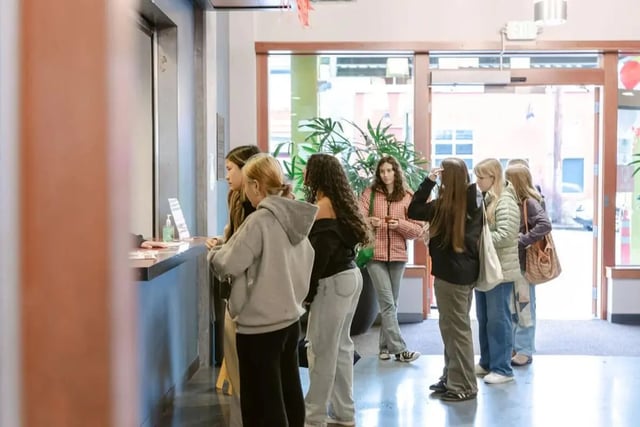 Students queue at reception desk hallway at The Douglas - Student Housing Apartments in Seattle Student Accommodation