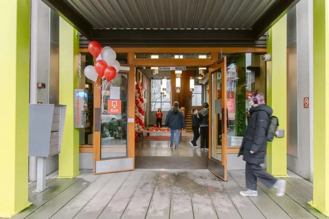 Entrance lobby with balloons and people exterior at The Douglas - Student Housing Apartments in Seattle Student Accommodation