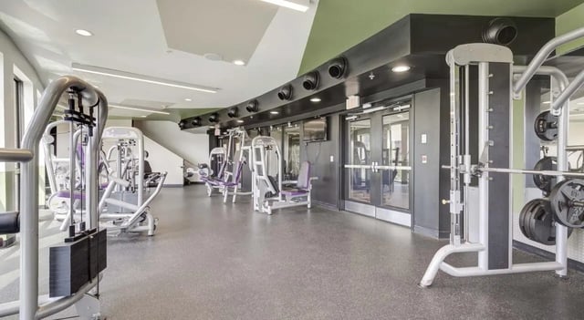 Weight machines barbells and plates gym at The Varsity College Park in College Park Student Accommodation