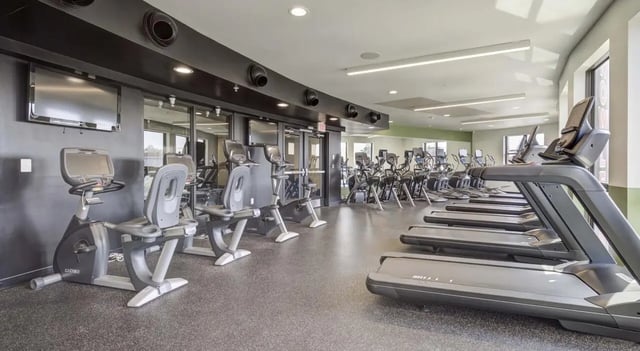 Treadmills exercise bikes and ellipticals gym area at The Varsity College Park in College Park Student Accommodation