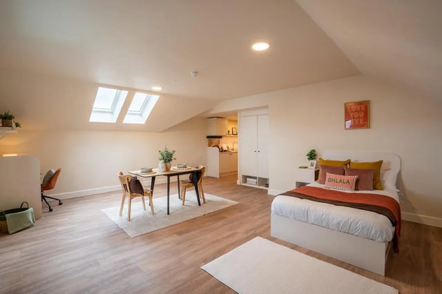 Bed dining table kitchen desk and bed area studio apartment at Valerian in York Student Accommodation