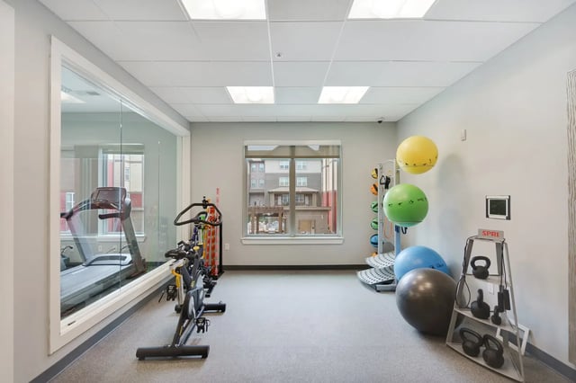 Treadmill exercise bikes and medicine balls fitness area at The Bloc in Lubbock Student Accommodation