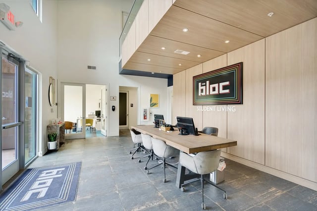 Reception desk computers and chairs lobby at The Bloc in Lubbock Student Accommodation