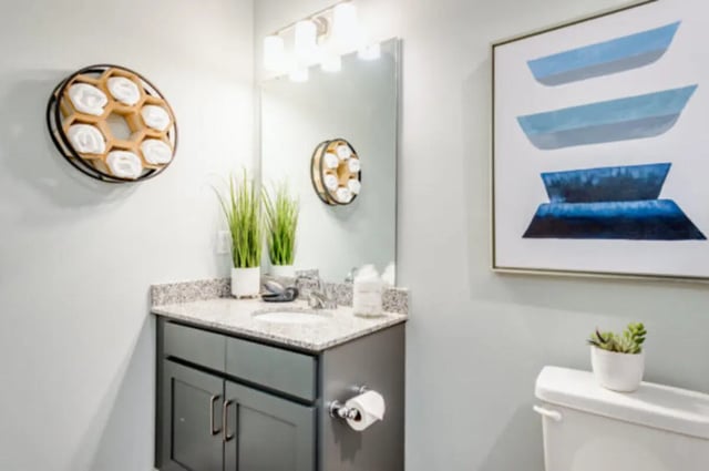 Gray vanity towel rack with plants and toilet Bathroom at The Husk and The Helm in Cullowhee Student Accommodation