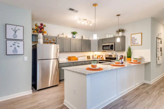 Modern kitchen with island stainless steel appliances kitchen at The Husk and The Helm in Cullowhee Student Accommodation