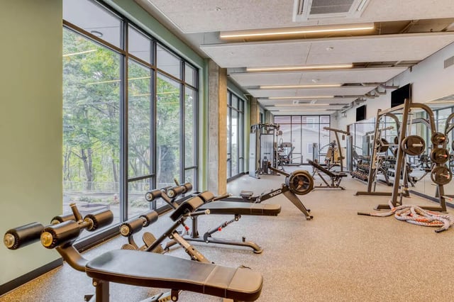 Weight benches rowing machine gym equipment gym fitness area at Stateside in Bellingham Student Accommodation