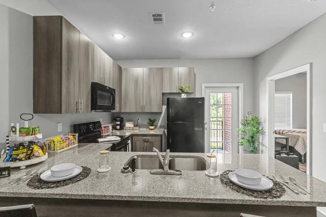 Modern student kitchen with appliances and counter space kitchen at Remerton Mill Apartments in Valdosta Student Accommodation
