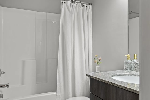 White bathtub shower curtain granite vanity bathroom at Remerton Mill Apartments in Valdosta Student Accommodation