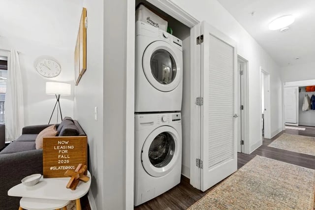 Stacked washer dryer in closet interior at Slate at 901 in Knoxville Student Accommodation