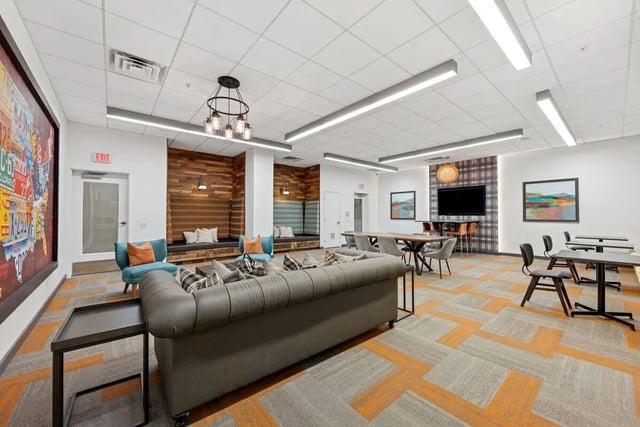 Sofa benches tables and chairs common area at Slate at 901 in Knoxville Student Accommodation