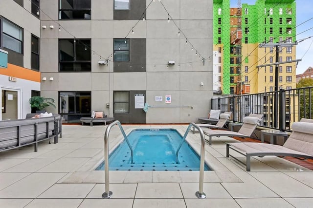 Jacuzzi lounge chairs and building exterior area at Slate at 901 in Knoxville Student Accommodation