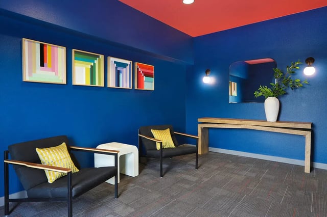 Modern lounge seating with abstract art lobby at NORA Apartments in Seattle Student Accommodation