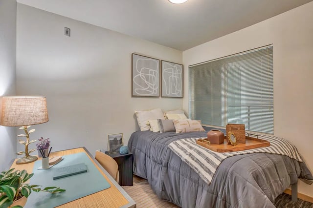 Bed desk lamp artwork window bedroom at NOLAN Apartments in Seattle Student Accommodation