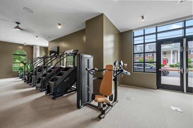 Multiple stair climbers and weight machine gym at Landmark Apartments in College Park Student Accommodation