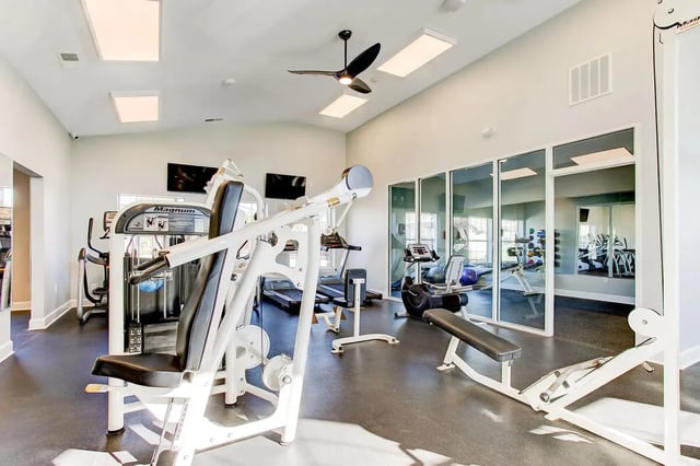 Gym equipment with weight machines treadmills and benches Gym at Stadium Suites in Columbia Student Accommodation