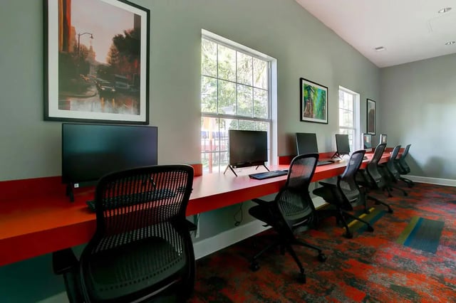 Computers chairs framed art study area at Stadium Suites in Columbia Student Accommodation