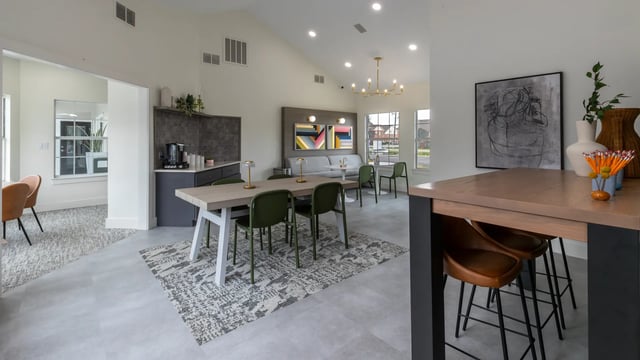 Dining table chairs sofa coffee station living area exterior at Maison Burbank in Baton Rouge Student Accommodation