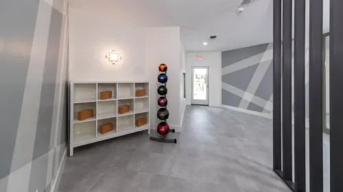 Rack of balls shelf with yoga blocks gym at Maison Burbank in Baton Rouge Student Accommodation