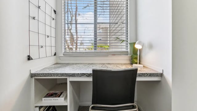 Desk with chair and lamp study area at Maison Burbank in Baton Rouge Student Accommodation