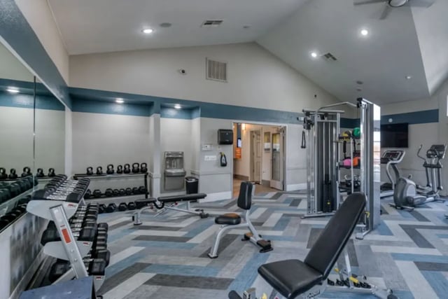 Dumbbells weights machines and treadmills gym at Copper Beech Townhomes in Clovis Student Accommodation