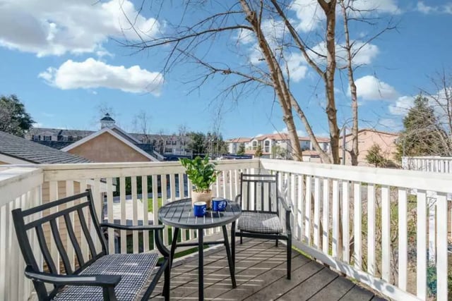 Chairs table plant outdoor living area at Copper Beech Townhomes in Clovis Student Accommodation