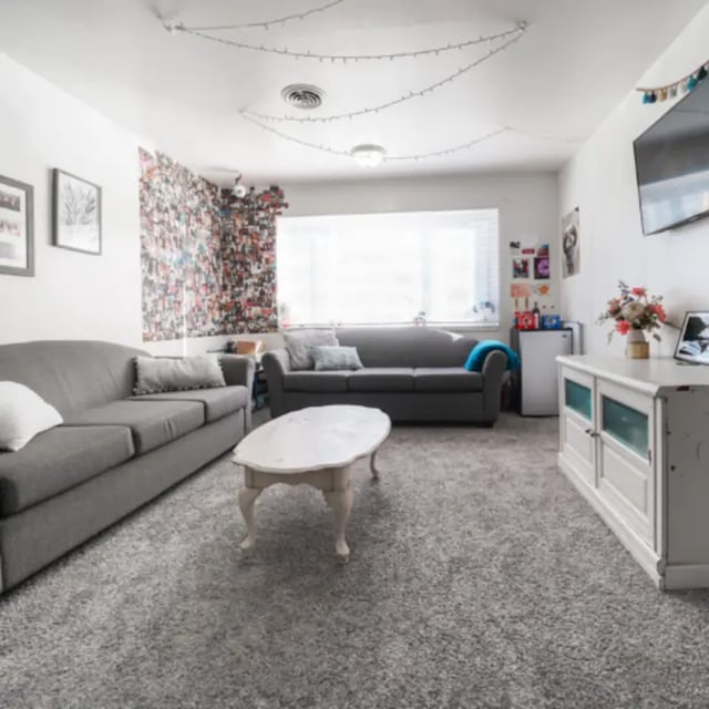 Two grey couches white coffee table living room at Campus Edge Milledgeville in Milledgeville Student Accommodation