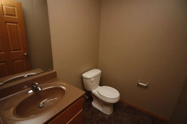 Toilet vanity sink and mirror bathroom at Conner Crossing Apartments -"The Porches" in West Lafayette Student Accommodation