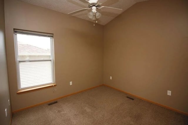 Carpeted room with window and ceiling fan bedroom at Conner Crossing Apartments -"The Porches" in West Lafayette Student Accommodation