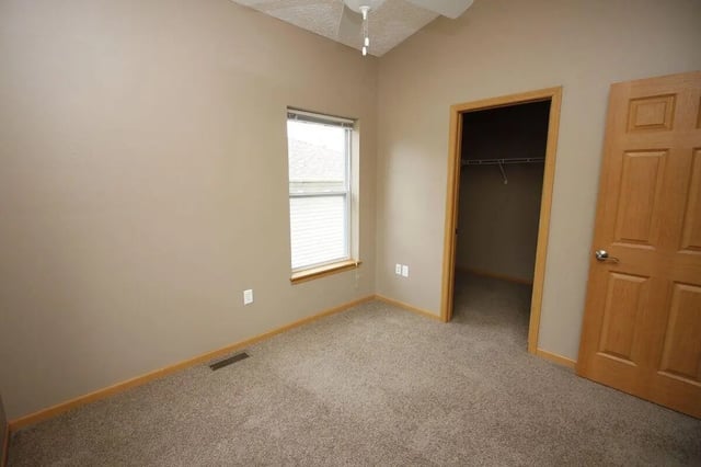 Empty bedroom with window and closet Bedroom at Conner Crossing Apartments -"The Porches" in West Lafayette Student Accommodation