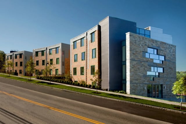 Modern student housing complex with stone exterior exterior at Collegetown Terrace Apartments in Ithaca Student Accommodation