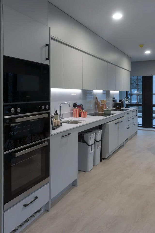 Modern kitchen with built-in oven sink and cabinets kitchen at Queen Street Place in Galway Student Accommodation