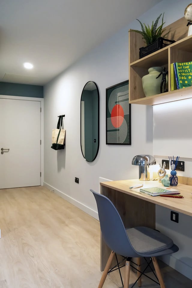 Desk with lamp chair and artworks study area at Queen Street Place in Galway Student Accommodation