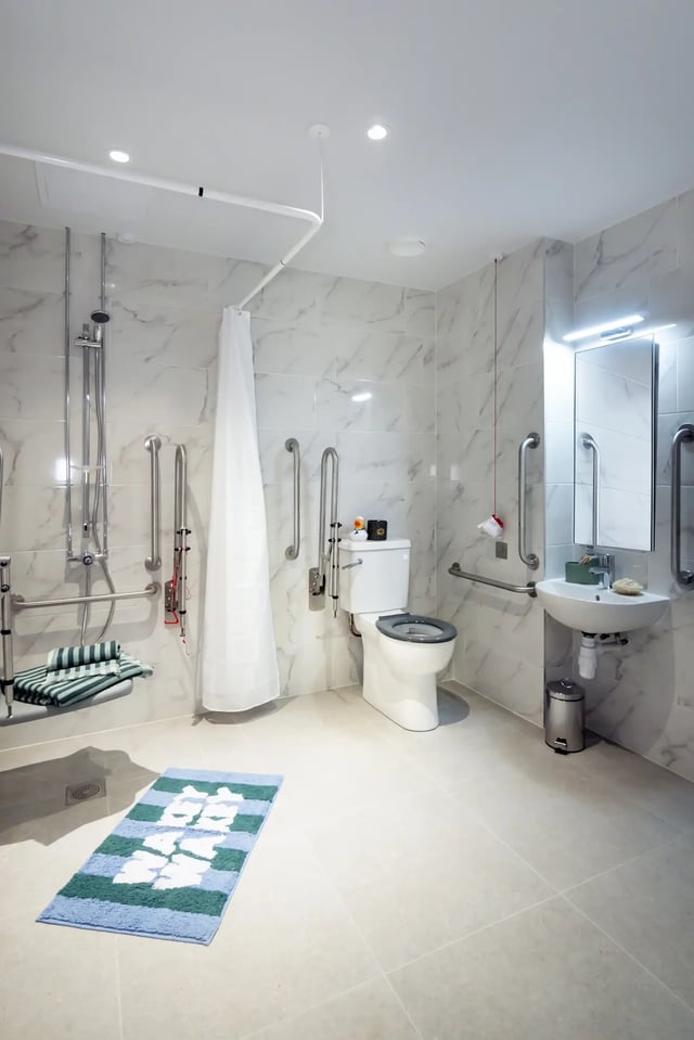 Shower seat toilet sink grab bars bathroom. at Queen Street Place in Galway Student Accommodation