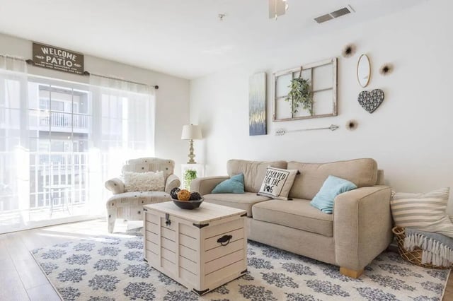 Sofa armchair trunk rug and lamp living room at Belmont Landing in Farmville Student Accommodation