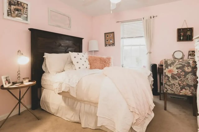 Bed with pillows and a fluffy accent pillow bedroom at Belmont Landing in Farmville Student Accommodation