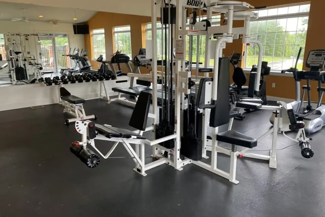 Weight machines treadmills and dumbbells gym interior at Belmont Landing in Farmville Student Accommodation