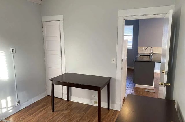 Two desks, closet, kitchen view, study area at Colonnade Rentals in Oneonta Student Accommodation