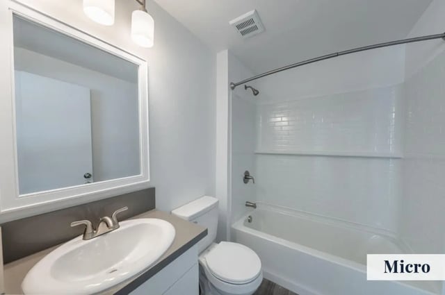 Sink toilet shower tub and mirror bathroom at Colony Studios and Apartments in Reno Student Accommodation