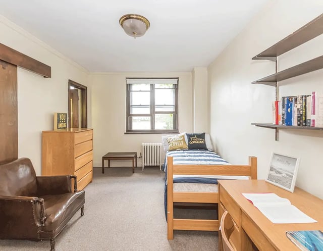 Bed dresser chair desk and shelves bedroom at 5748 Blackstone by 3L Living in Chicago Student Accommodation
