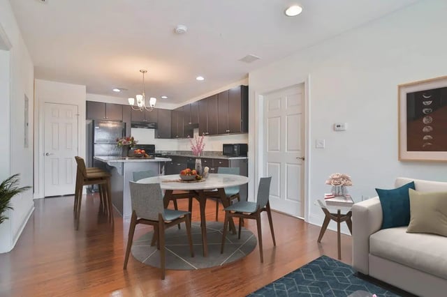 Round table with chairs kitchen living area at 58 E. Main St. Apartments in Newark Student Accommodation