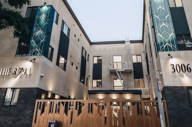 Modern apartment building with ornate gate exterior at Corsica in Los Angeles Student Accommodation
