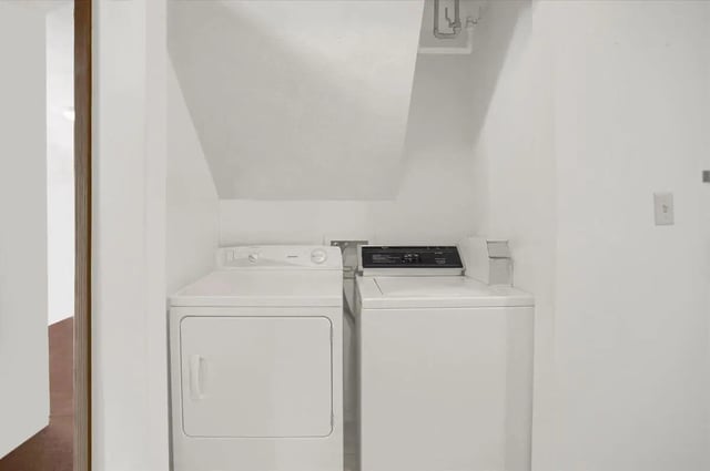 Two white washing machines and dryer laundry room at Cedar Lofts East Apartments in State College Student Accommodation