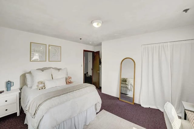 Bed teddy bears framed art mirror bedroom at Cedar Lofts East Apartments in State College Student Accommodation