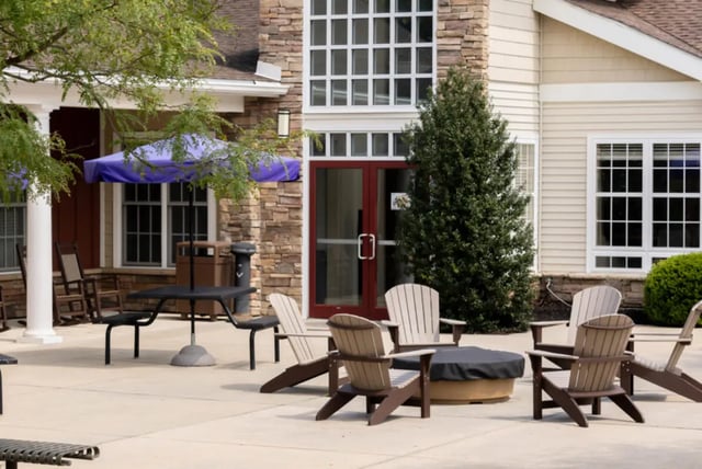 Adirondack chairs surrounding fire pit exterior at East Village at WCU in West Chester Student Accommodation