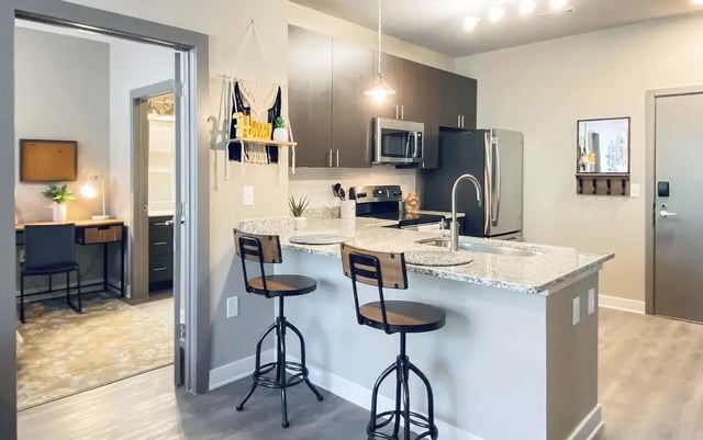 Kitchen island bar stools desk and chair kitchen. at Cedar Pointe Apartments in Blacksburg Student Accommodation