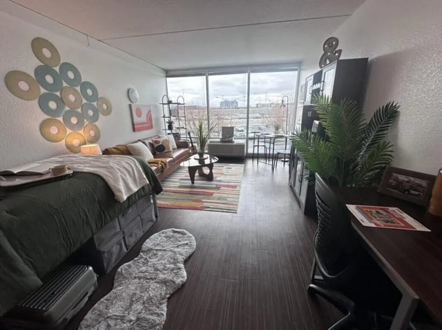 Bed sofa table and desk living room at Assembly Student Living in Denver Student Accommodation